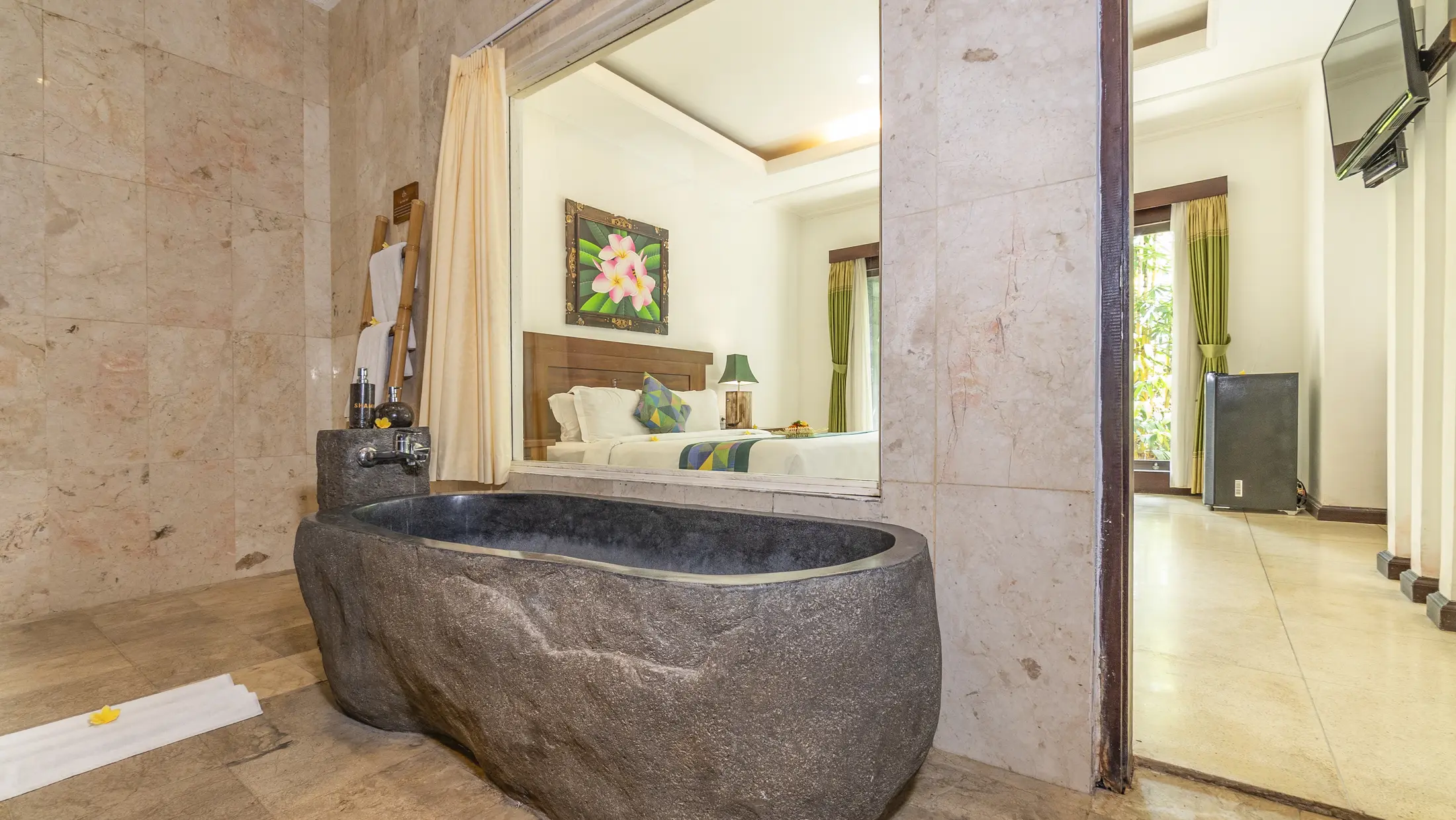 Stone bathtub in a Gita Maha Hotel guest room