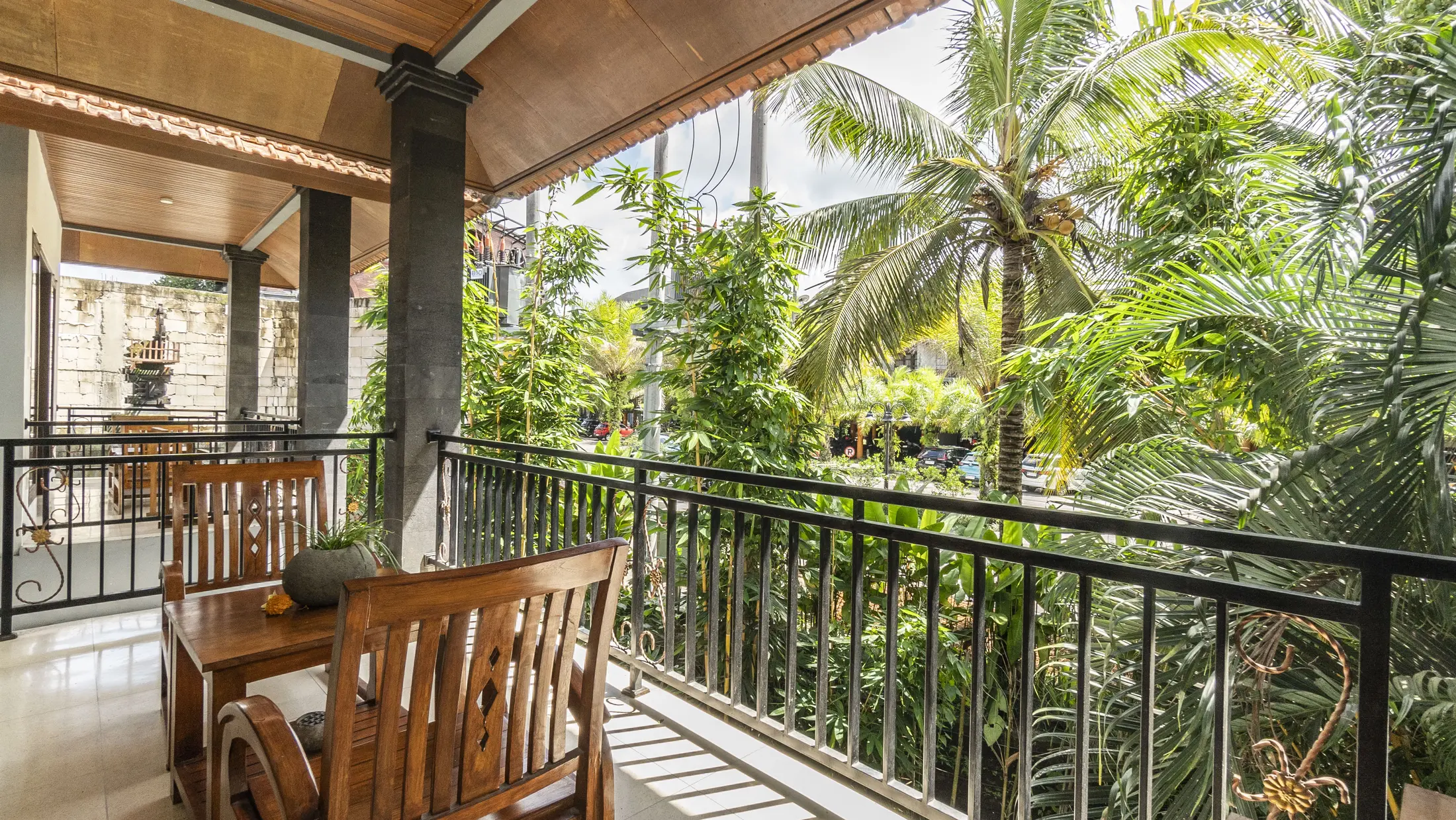 Private room balcony overlooking tropical greenery